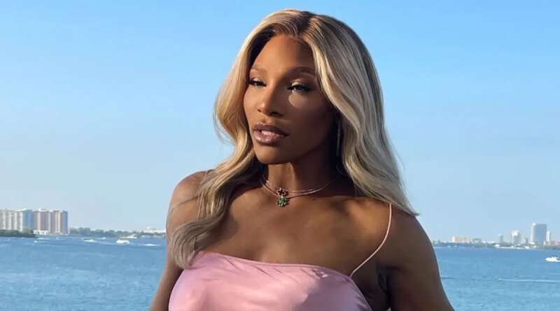 Serena Williams Wears Pink Silk Dress Without a Bra