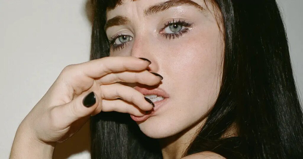 Sabrina Carpenter Looks Stunningly Different with Brown Hair and Bangs