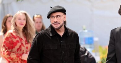 John Travolta's Viral Cannes Look: Beret and Glasses Steal the Show